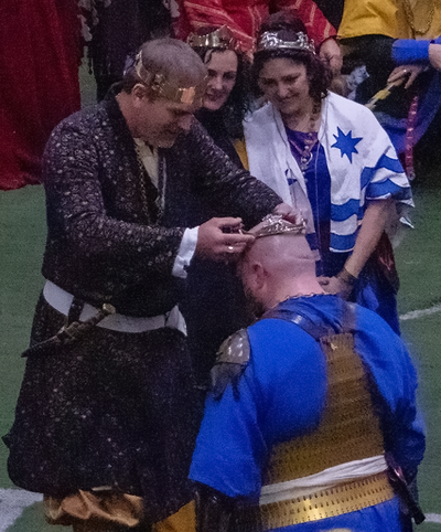 Princeps Brennan being crowned by King Mohammed